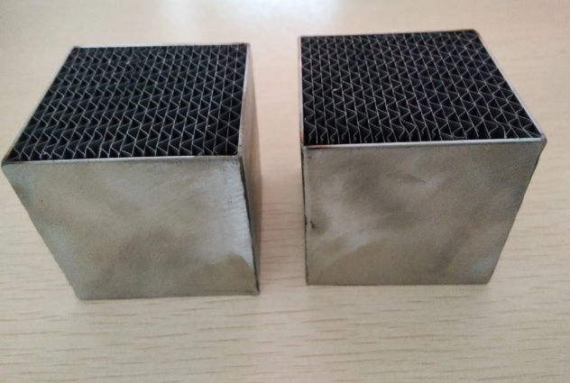 thin precious metal coating spread across the converter's honeycomb surface