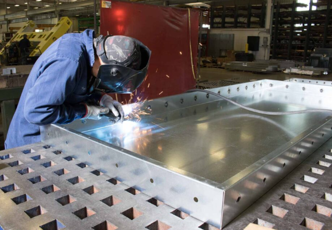 measuring cutting and fitting sheet metal during daily shop work