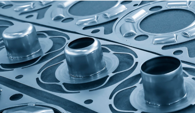 progressive die stamping transforms metal coils into precision parts through sequential station operations