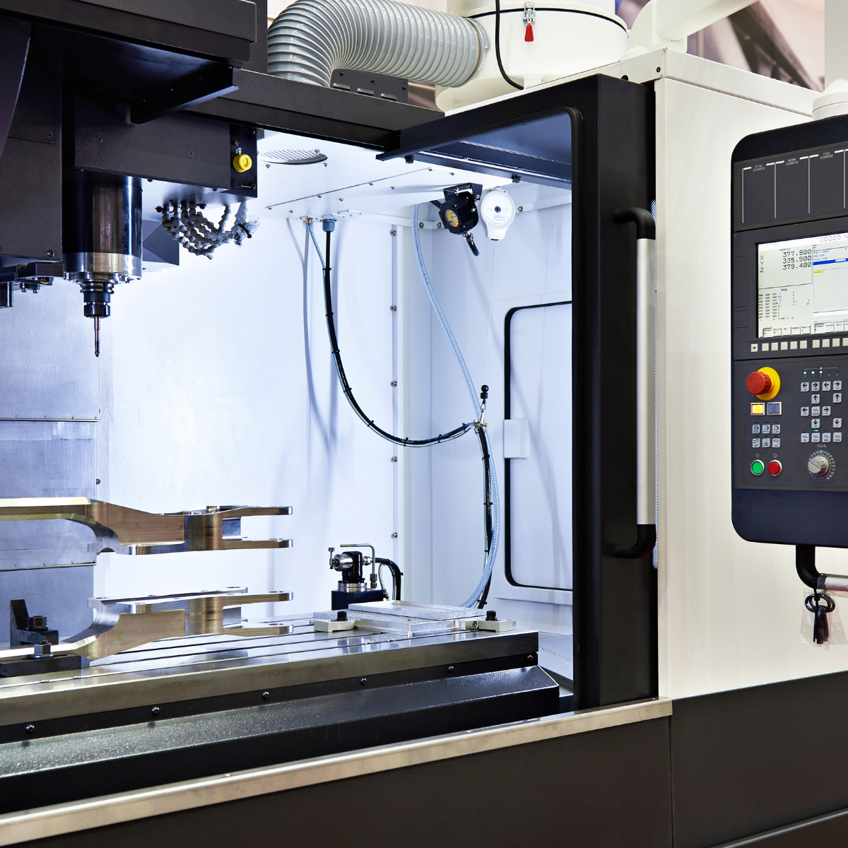 cnc machine precision cutting metal component in modern manufacturing facility