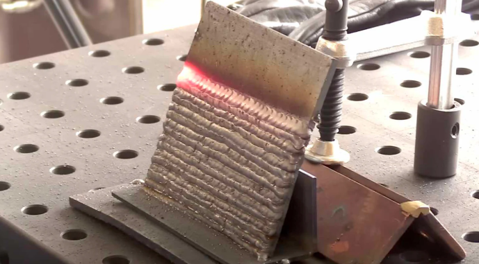 running a short mig practice bead with steady body position