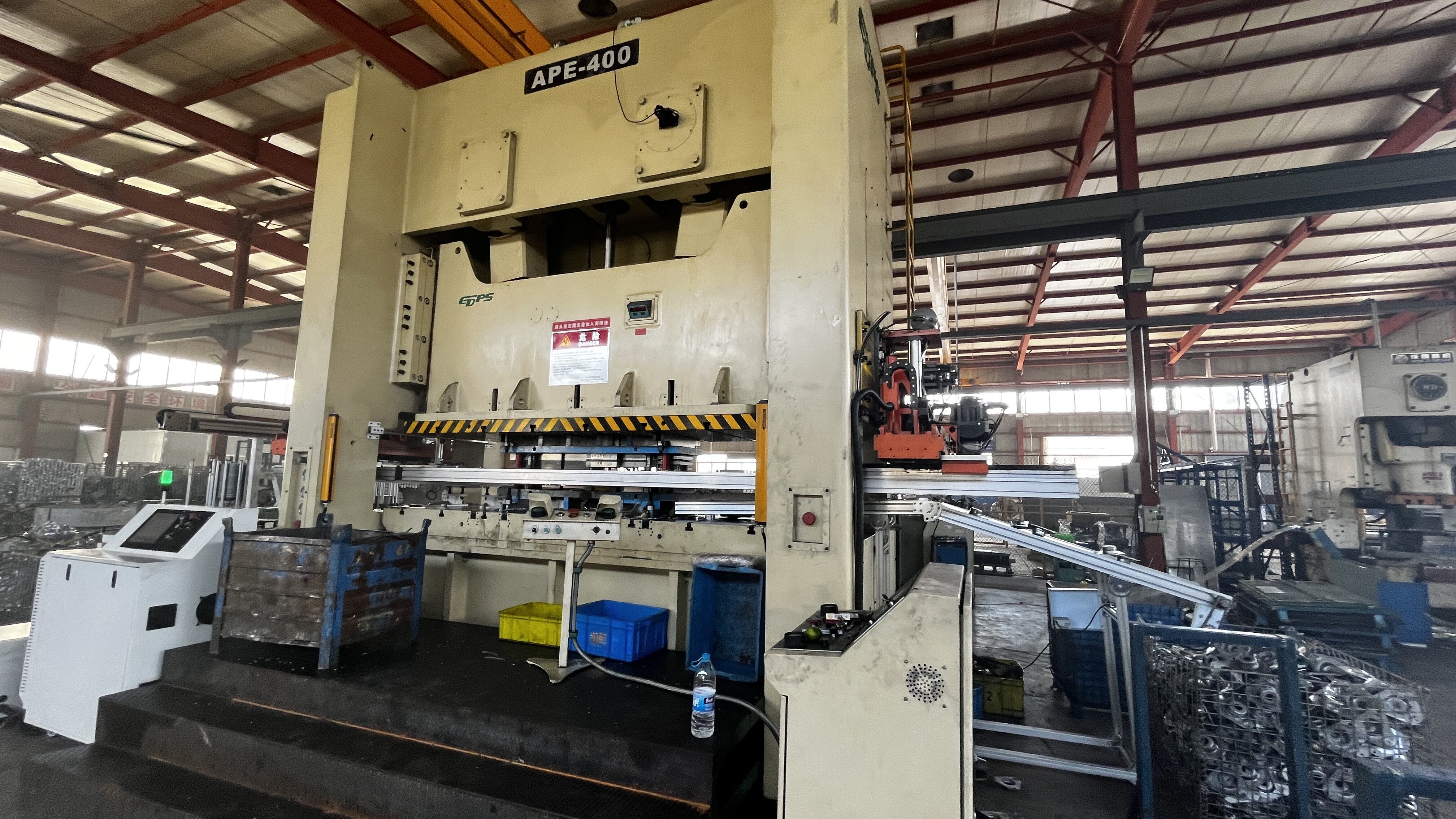 flywheel and clutch assembly that stores and releases energy for stamping operations