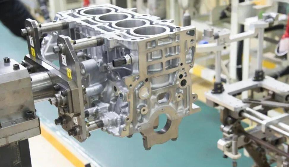 cnc machining center performing precision cylinder boring on a v8 engine block