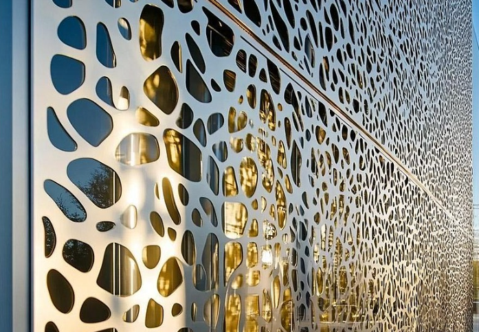 architectural perforated metal facade panels providing solar shading and visual interest
