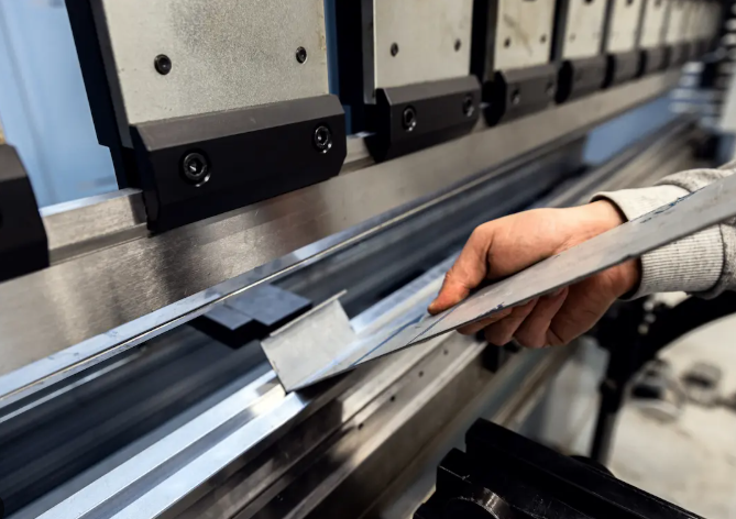 industrial press brake forming sheet metal into precision components