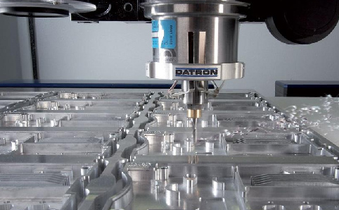 cnc machine precision cutting metal prototype in professional fabrication workshop