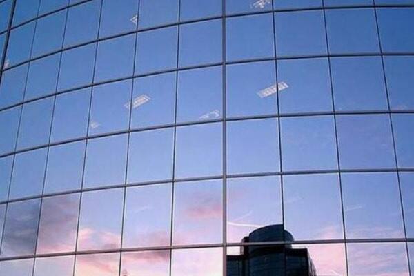 How Does Reflective Coated Glass Reduce Solar Heat Gain?