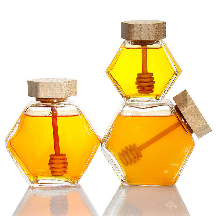 Hexagonal glass honey jar with spoon.jpg