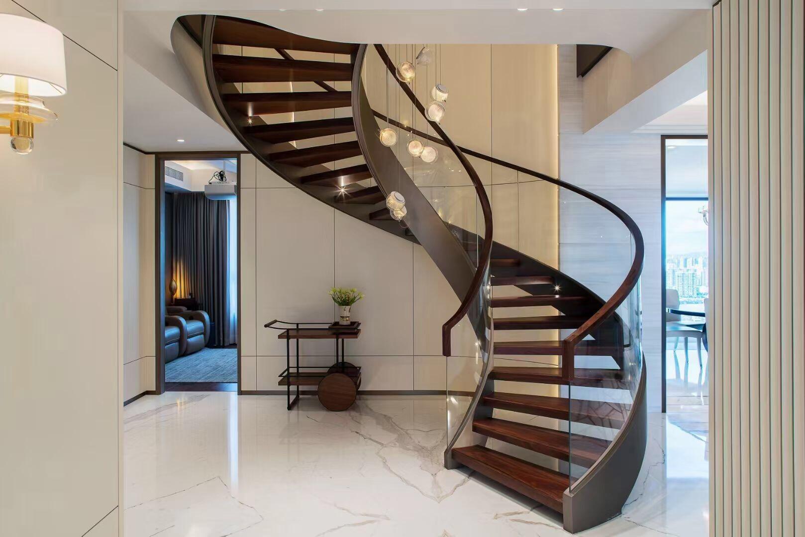 Beech wood High level hot sale Luxury design Customized Carbon Steel curved stairs With Tempered Glass Railing manufacture