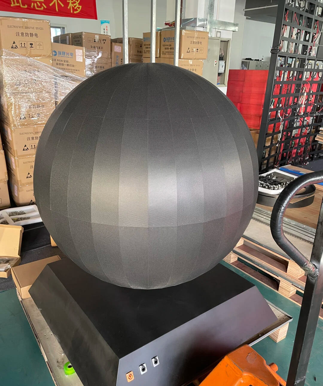 What technical difficulties are there in making spherical LED displays?