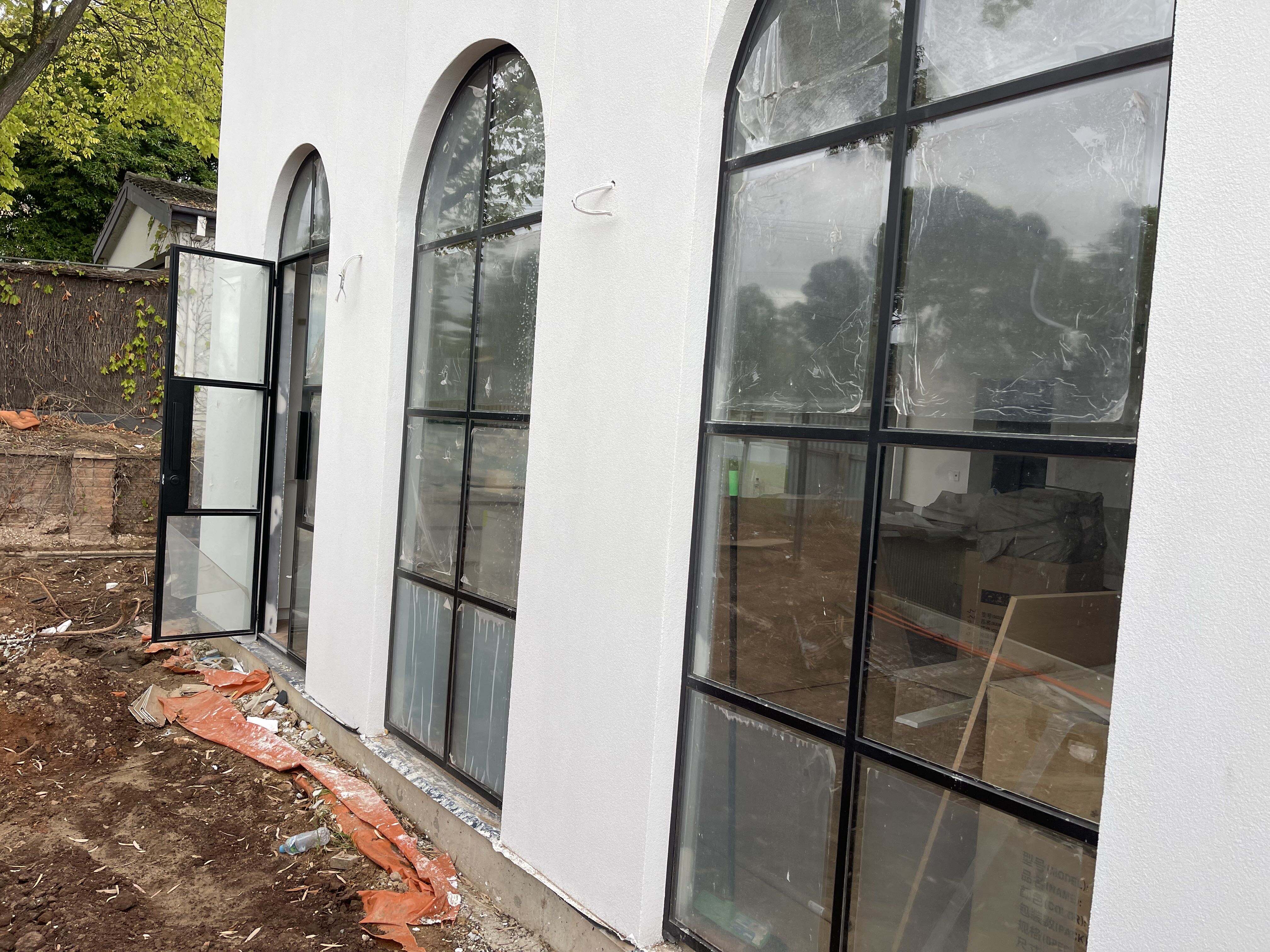 Why steel arch doors add a timeless European elegance to your facade.