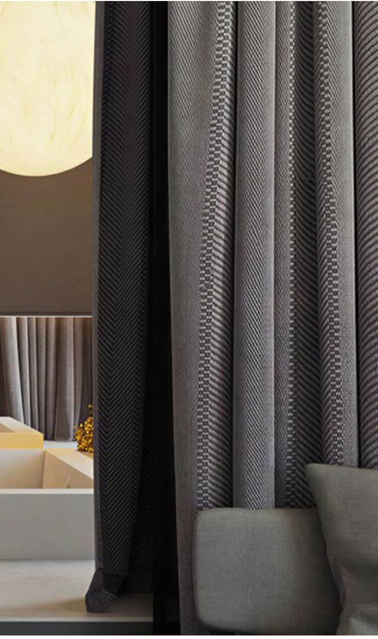 Dark gray linen-look twill curtains in hotel-style interior, textured weave with elegant drape