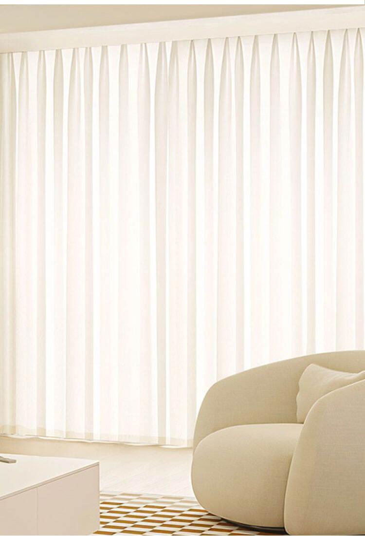 Full-width pleated sheer curtains in a modern living room, diffusing light for an airy look and comfortable privacy.