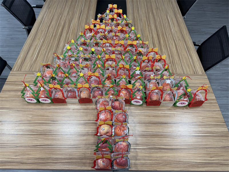 A Christmas tree display made of gift packs—turning blessings into a visible celebration