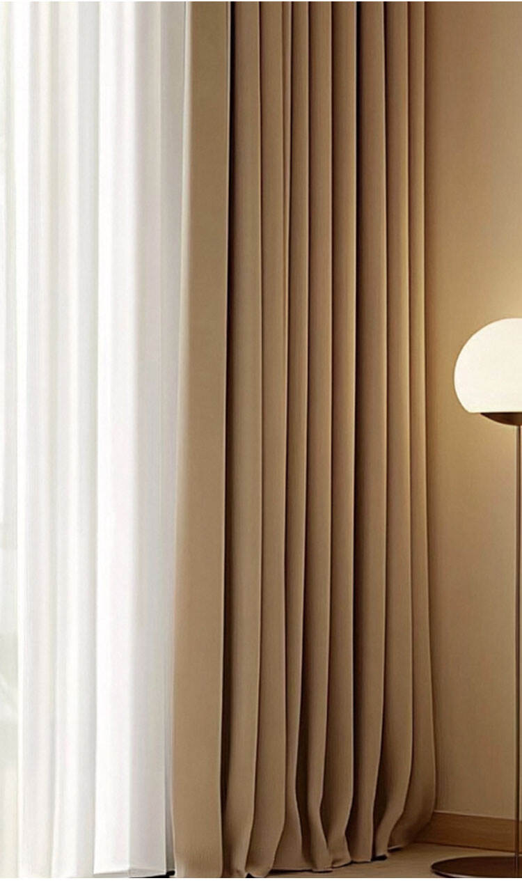 Close-up of taupe chenille blackout drapes and sheer curtain, layered window treatment with elegant folds