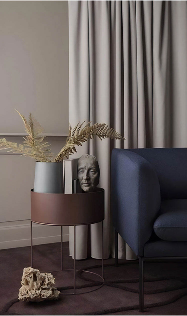 Matte satin blackout curtains in gray tone, soft drape in a modern living room corner with sofa