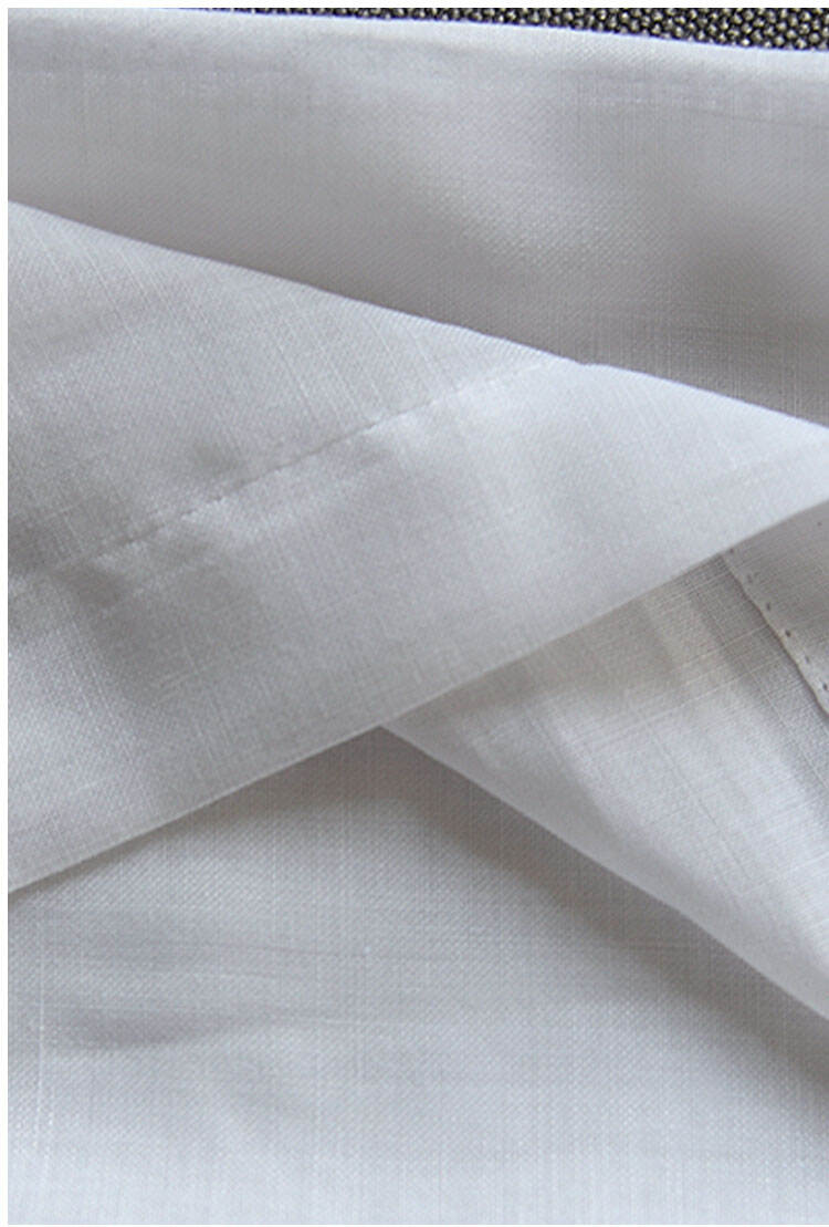 Close-up of white polyester sheer curtain fabric texture, showing tight weave and clean finishing for a soft, airy look.