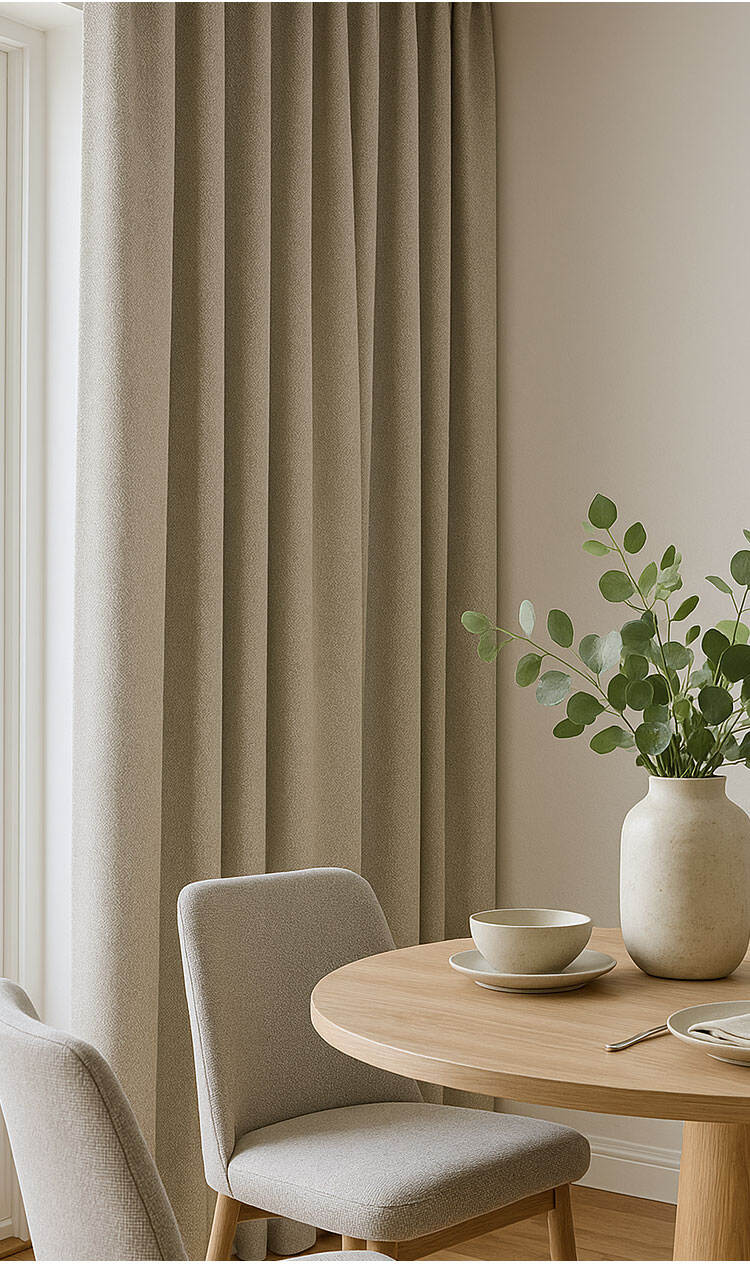 Neutral beige blackout curtains in dining area, linen-look texture with soft sheen for modern interiors