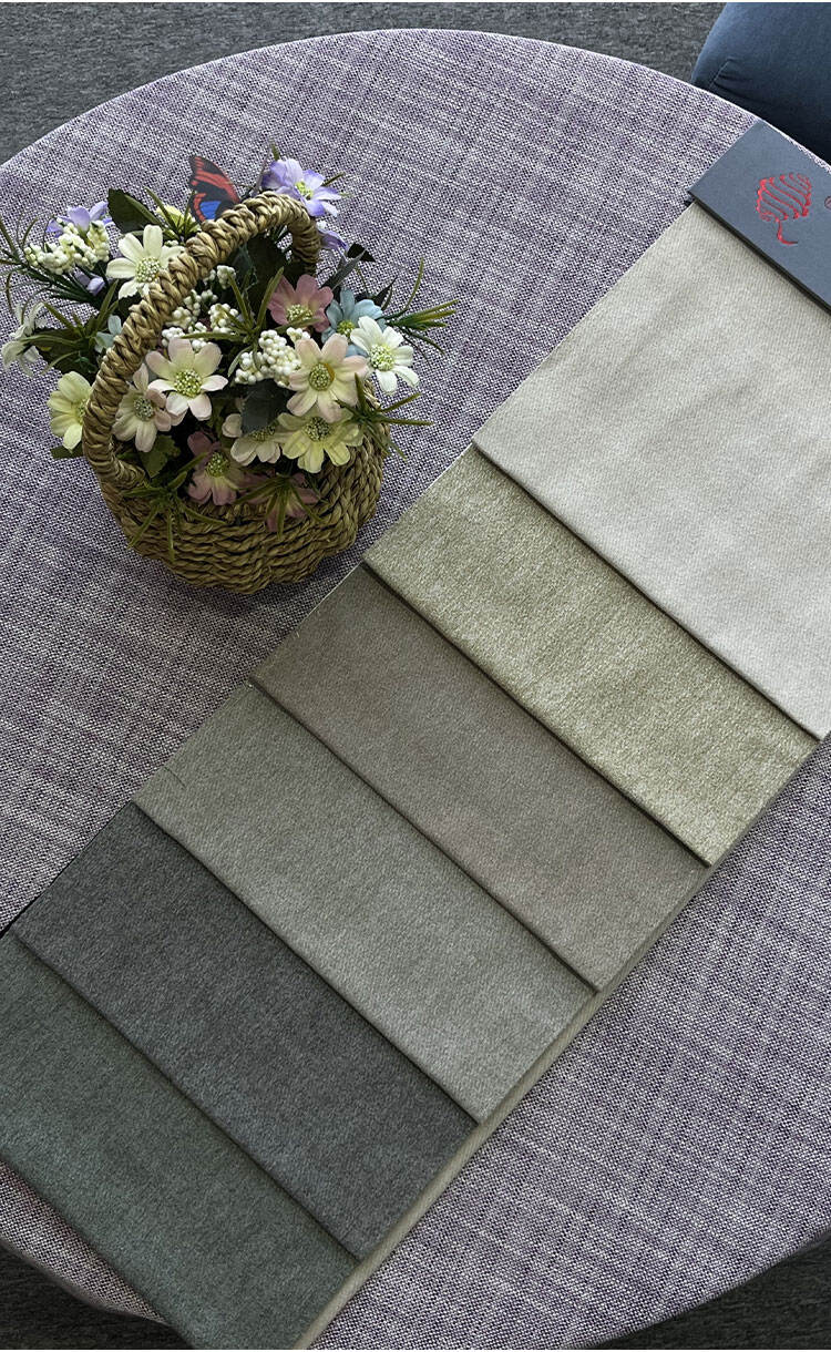 Faux Cashmere Twill fabric color swatches displayed on a table, offering multiple shades to choose.