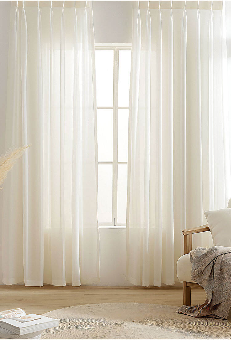 White bamboo slub sheer curtain panels on a tall window, gently diffusing light for a clean, relaxing bedroom or lounge space.