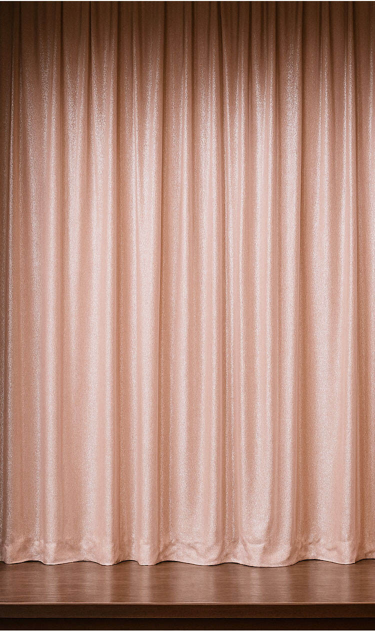 Full-length champagne-toned shimmering curtains with soft vertical pleats and a gentle metallic glow.