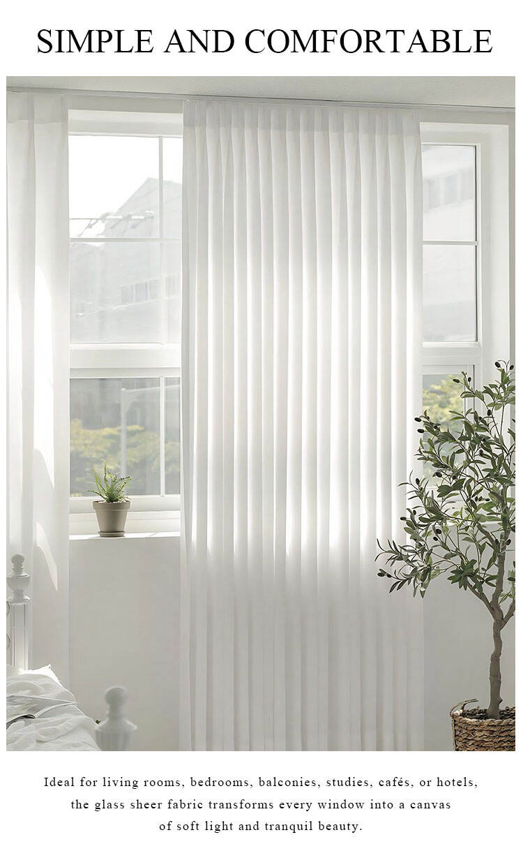 White glass sheer curtains on a large window, diffusing daylight for a simple and comfortable bedroom or living room.
