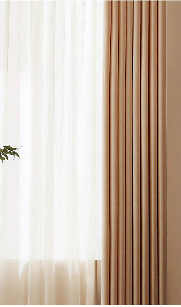 Close-up of sheer curtain and beige drape pleats, clean minimalist layering for window treatment