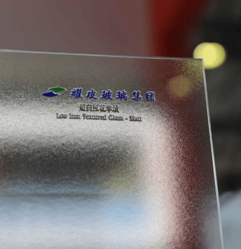 What are the environmental impacts of architectural glass production and disposal?