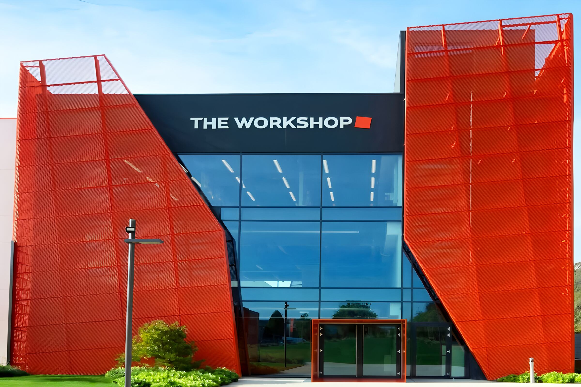 Vibrant Orange: Crafting the Beauty of Perforated Metal Facades for the Modern Creative Space 