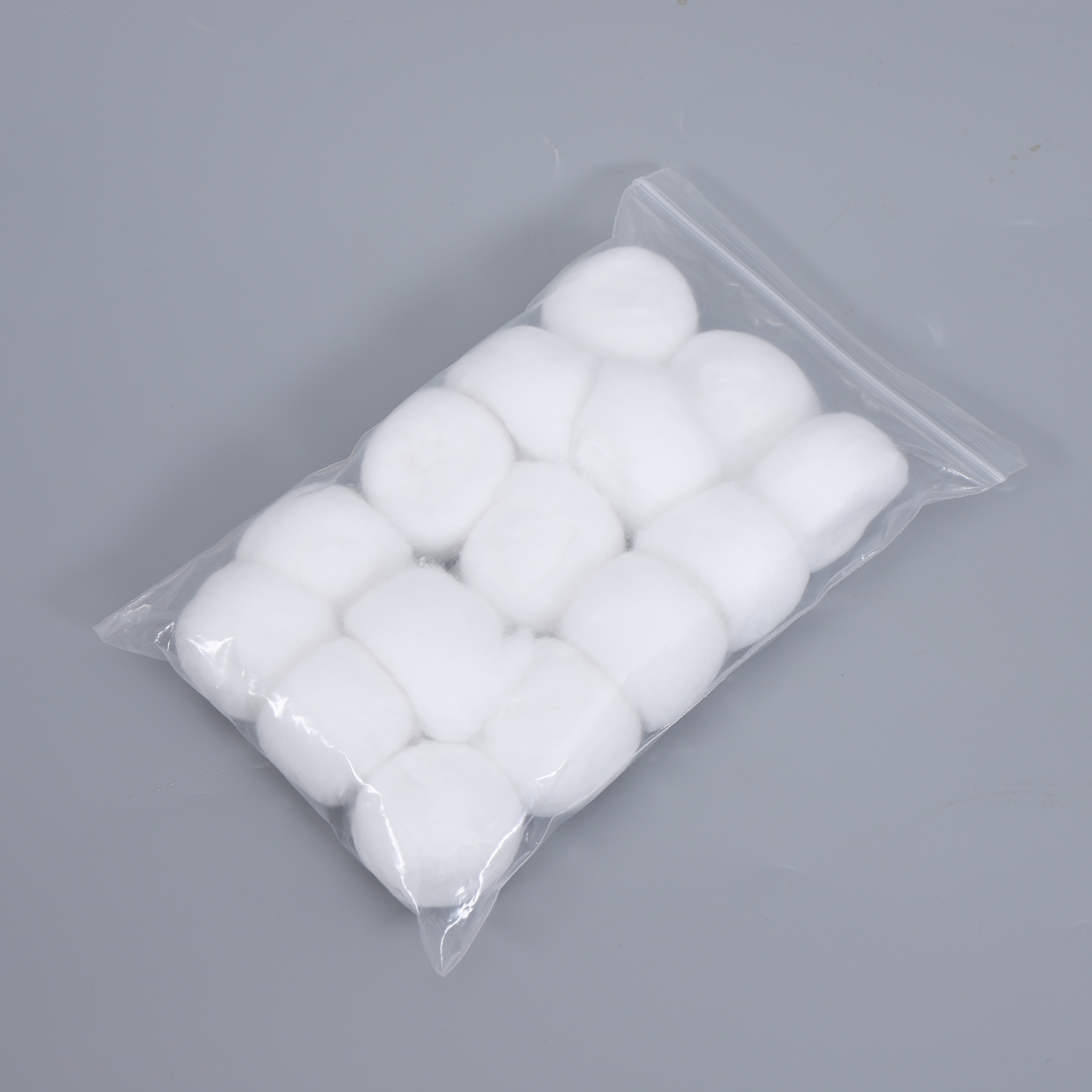 How do cotton balls compare to other cotton products in terms of absorbency and softness?