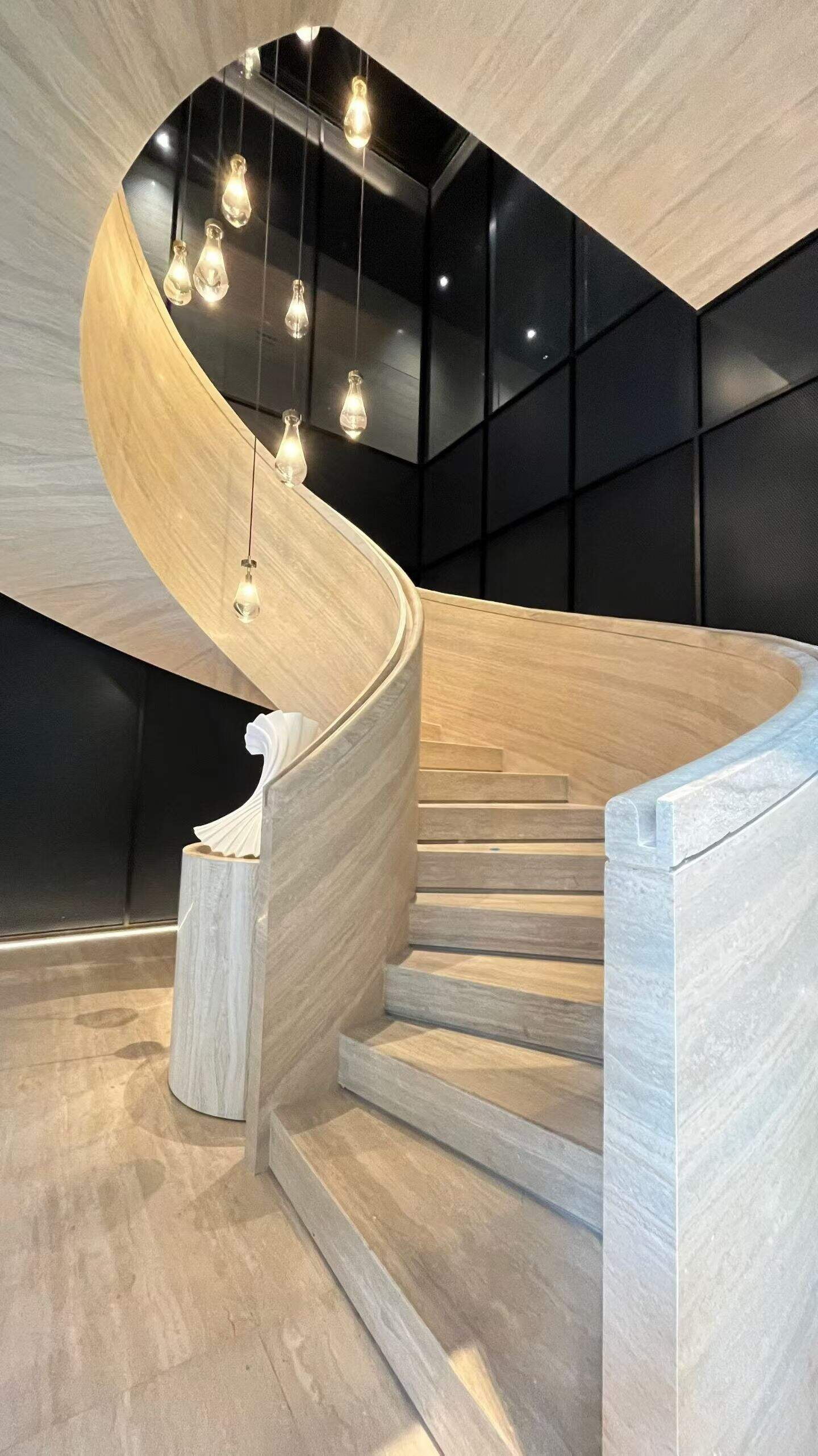 silver travertine rotating staircase.jpg