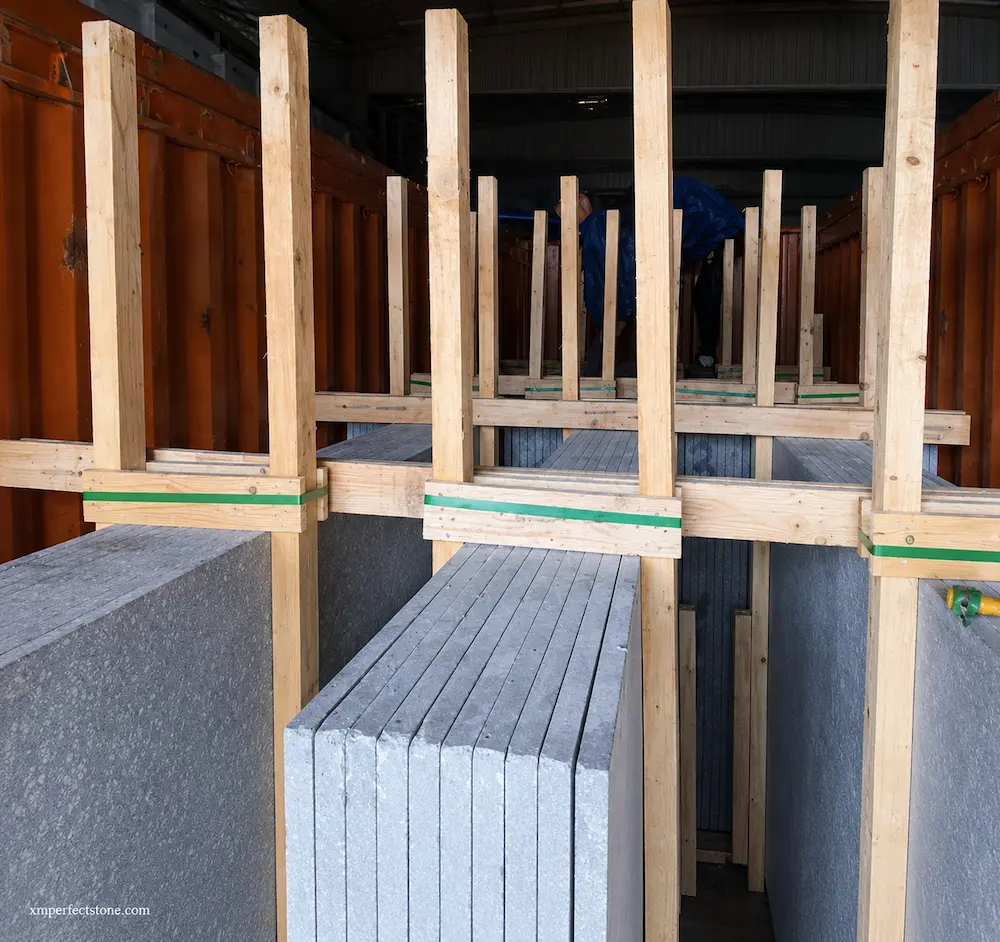 marble-slabs-stored-on-wooden-a-frame-after-unloading.webp