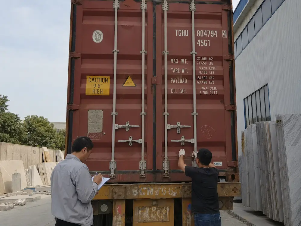 container-door-inspection-before-marble-slab-unloading.webp