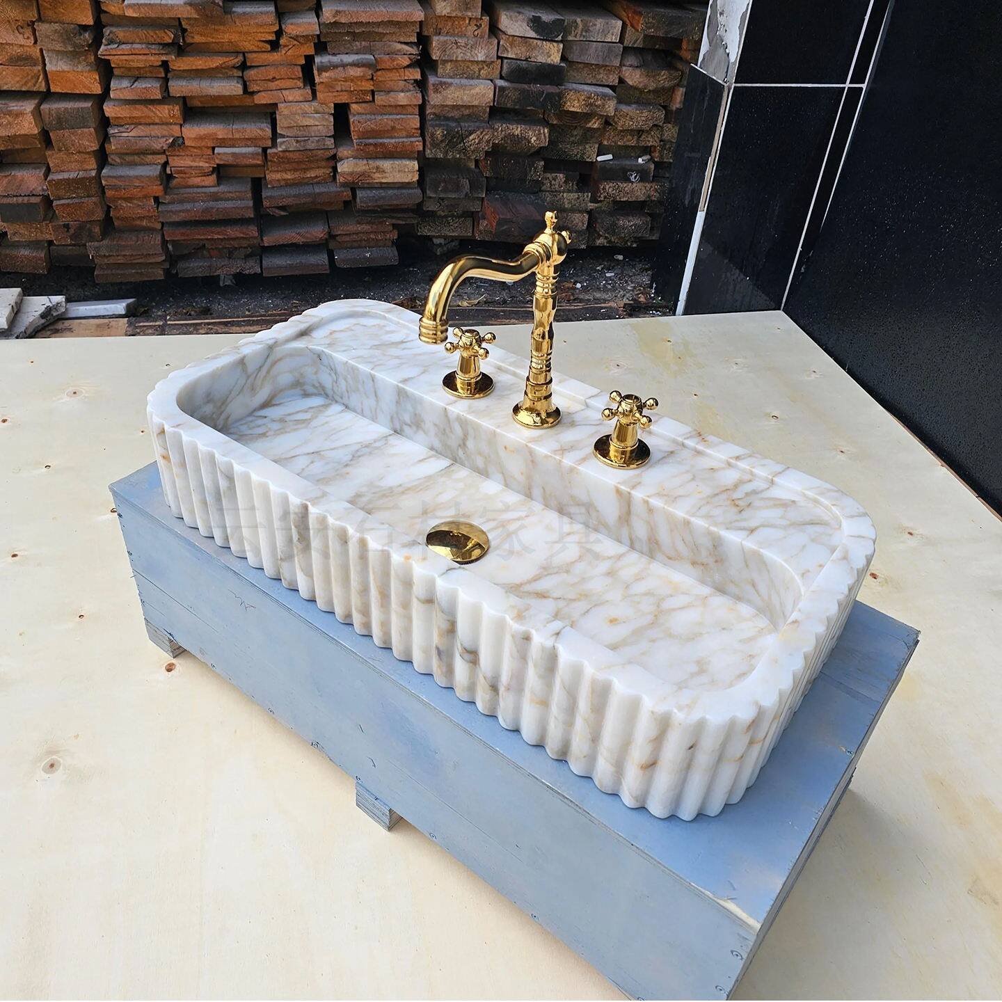 fluted wall mounted marble sink.jpg