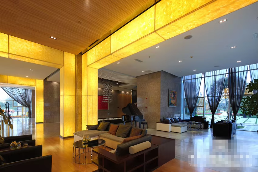 How do faux onyx panels compare to natural onyx in cost?