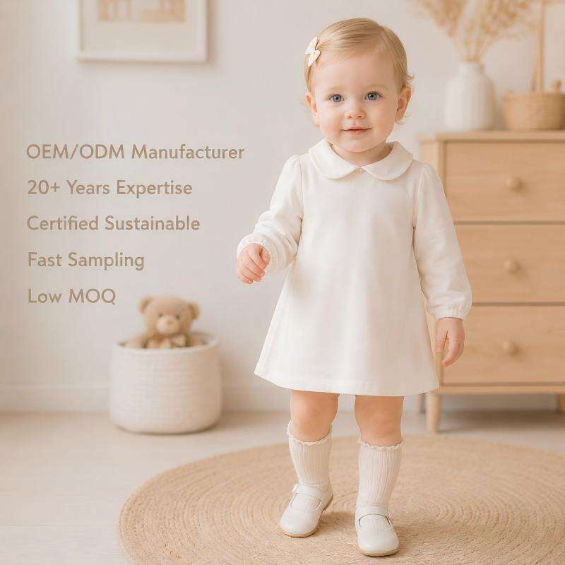 Brugerdefineret producent af kjoler til baby piger, OEM og ODM | Kjole til spædbørn med lange ærmer og bomuldsmateriale med Peter Pan-krause | Leverandør af butikskvalitets babytøj til private mærkevarer