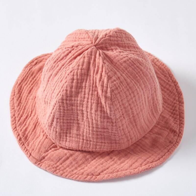 Fabricant personnalisé de chapeaux-baquet bio pour bébés | Chapeau solaire pour nourrissons en coton mousseline teint aux plantes, destiné aux marques de vêtements pour bébés en fabrication sous marque propre (OEM) et conception sous marque propre (ODM)