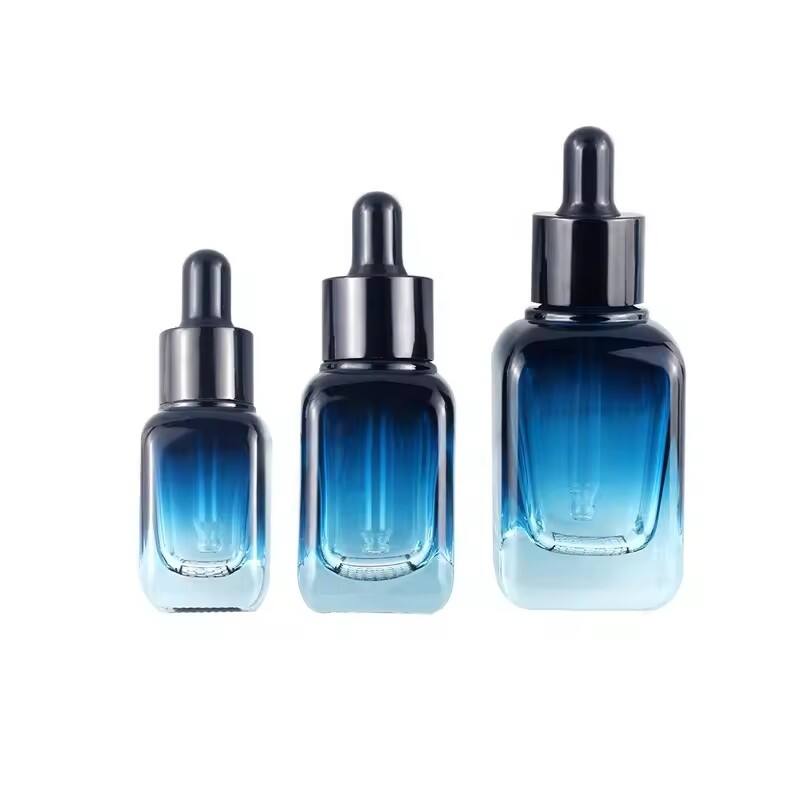 Custom square grid bottom blue gradient cosmetic glass bottles essential oil glass bottle serum packaging glass dropper bottle factory