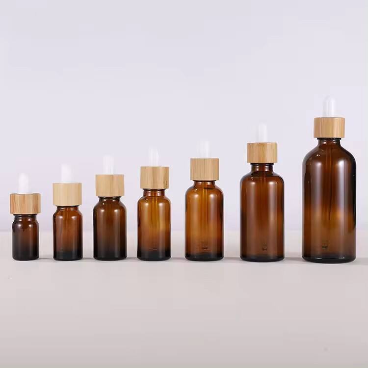 Amber packaging essential oil OEM /ODM glass packaging container bamboo cap Dropper bottle manufacturer supplier