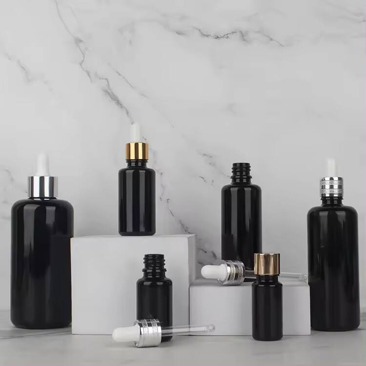 Custom 10ml/15ml/30ml/50ml/100ml/200ml black Essential Oil Packaging Bottles Glass Bottle Dropper glass Bottle wholesale factory