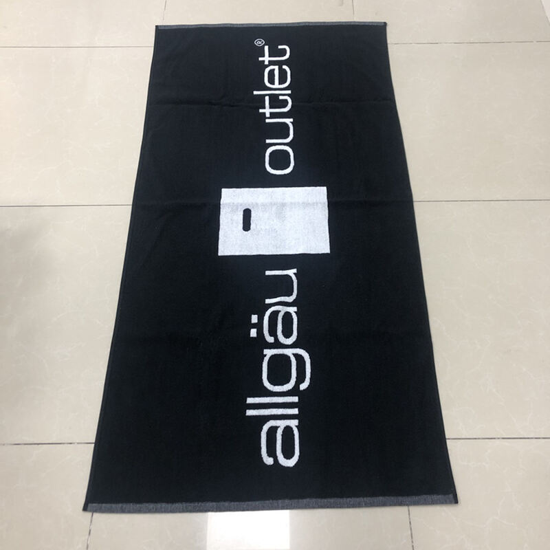 Custom 100% cotton classic black and white woven jacquard design beach towel supplier