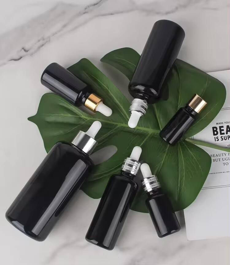 Custom 10ml/15ml/30ml/50ml/100ml/200ml black Essential Oil Packaging Bottles Glass Bottle Dropper glass Bottle wholesale manufacture